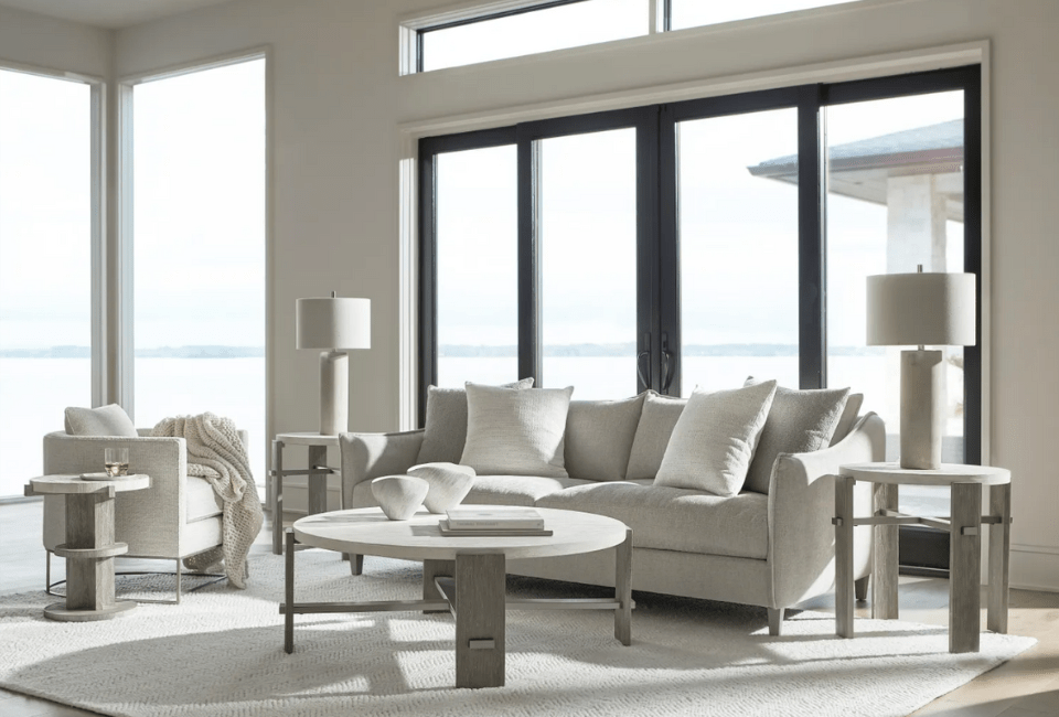 living room with fabric sofa and chair, coffee table with three matching end tables over an area rug