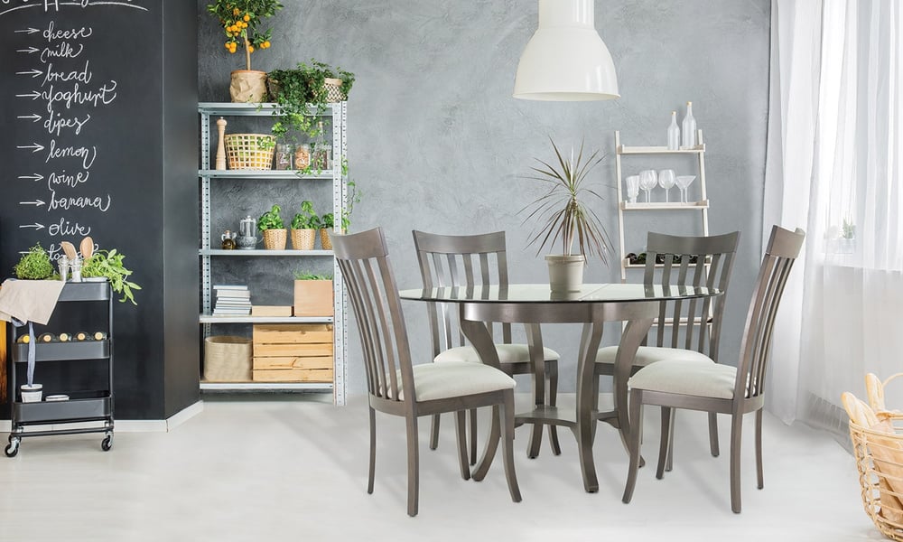 circular dining table with four chairs with rolling cart, shelves, and chalkboard wall with grocery list