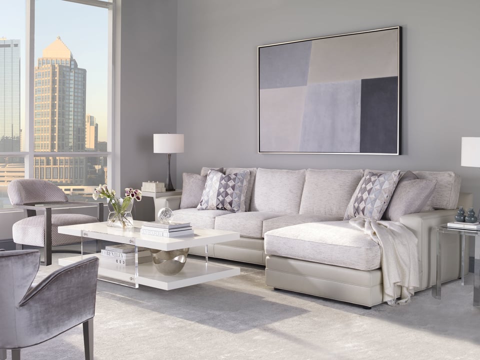 living room with sofa chaise and two accent chairs around a coffee table