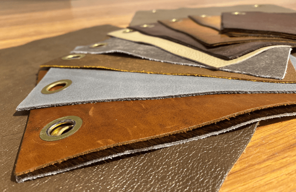 twelve samples of different types of leather neatly laid out