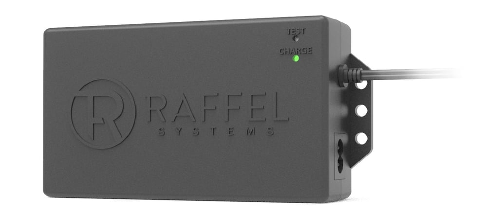 close up of a battery pack labeled Raffel Systems, with an off test light and a chare light that is on