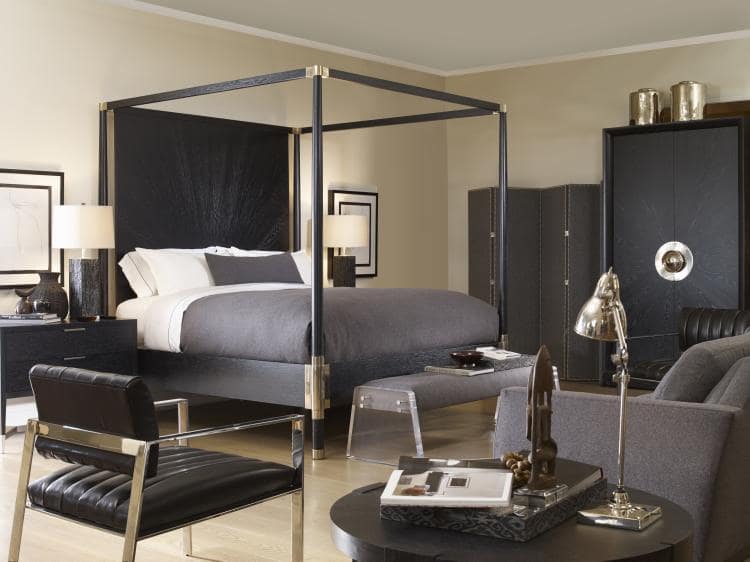 bedroom suite with poster bed, three accent chairs, two matching night stands with lamps and one occasional table