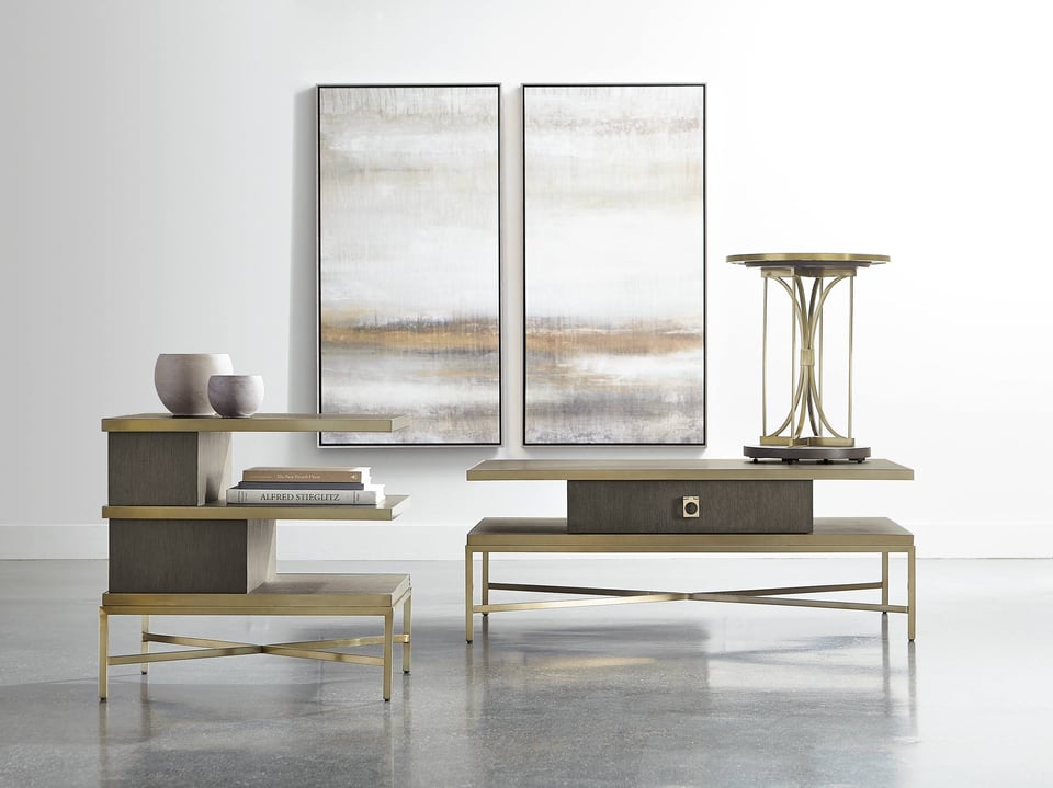 three cocktail tables in front of two pictures, each offering multi surfaces and storage