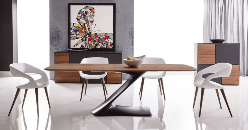 mid-century modern wooden dining table with four dining chairs in front of a buffet and picture of a butterfly
