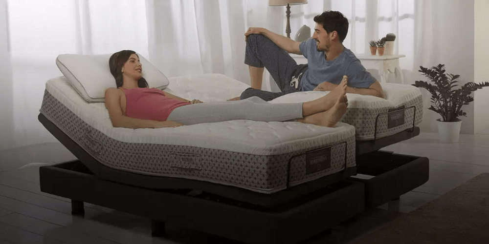 happy young couple lays in undressed adjustable bed at different settings