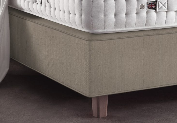 divan mattress with legs underneath an innerspring mattress